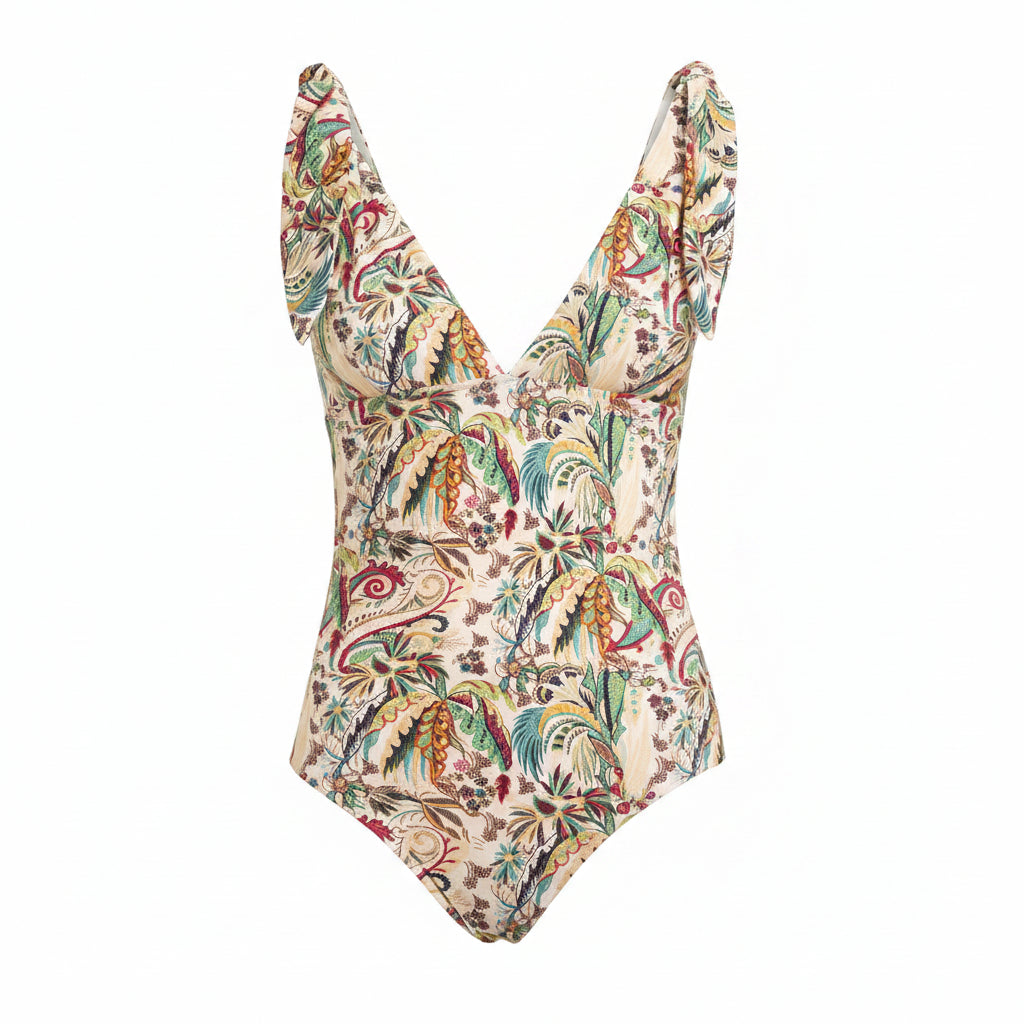 A one-piece swimsuit with a ruffled sweetheart neckline and a multicolor paisley print on a light beige background, shown against a solid gray background.