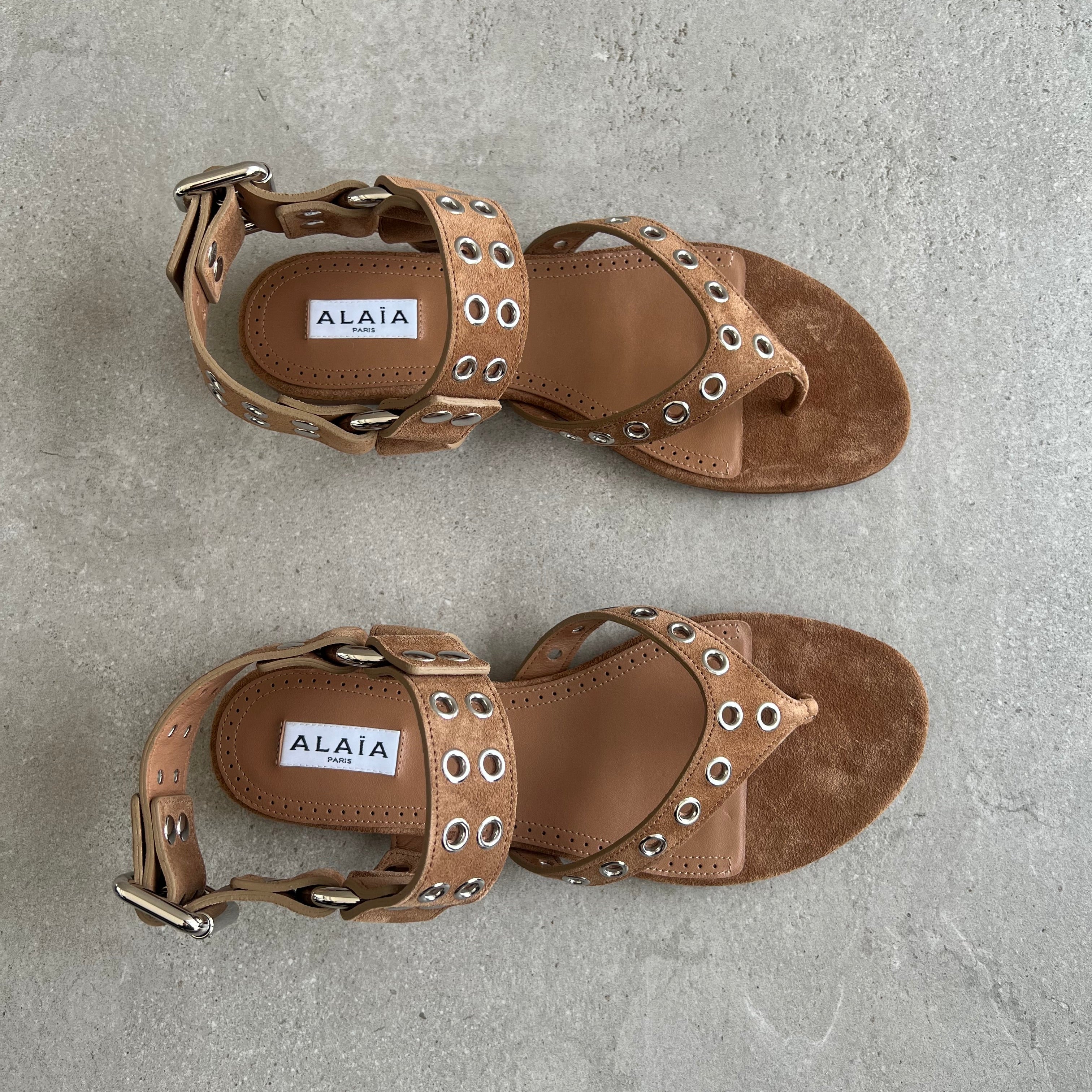 ALAIA Flat Eyelet Stud Thongs Suede, Terre D'Ombre – CULTSTATUS