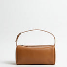 Brown leather handbag on a white background